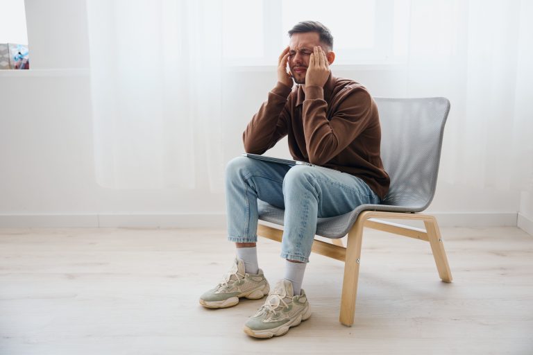 Man feeling pressure and pain in his head with a potential concussion